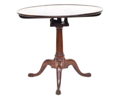 A 19th century mahogany dished top tripod table, with birdcage action on tripod scrolling legs, terminating in pointed pad fe