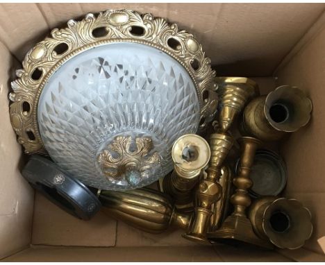 A mixed lot of brass ornaments including vases and candlesticks, a pewter ashtray, and a ceiling light 