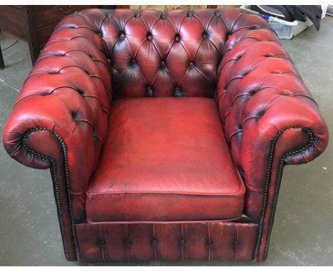 A button back Chesterfield armchair upholstered in oxblood leather 