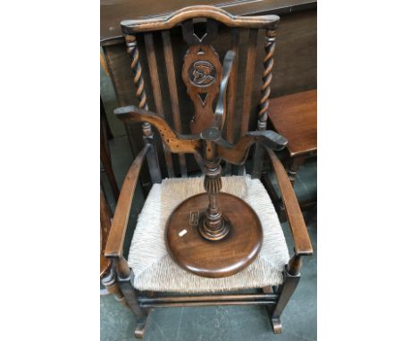 A rush barleytwist rocking chair, together with a tripod table, retailed by Highway, Merriott 