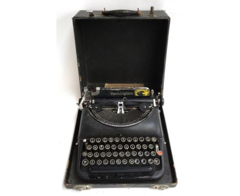 A Remington World Service portable typewriter with carry case 