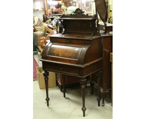 Late Victorian Mahogany Ladies Writing desk, the super- structure above a cylinder roll front opening to reveal a fitted inte