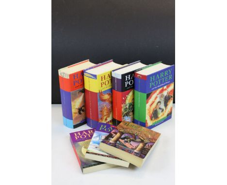 Seven First Edition Harry Potter Books including Paperback Chamber of Secrets,  Prisoner of Azkaban and The Sorcerer's Stone 