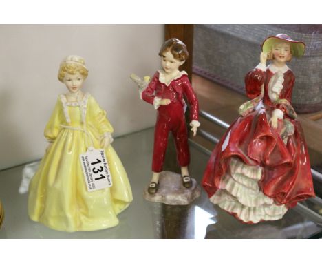 Three ceramic Figurines to include Royal Doulton "Top O' The Hill" HN1834, Royal Worcester "First Dance" 3629 by F G Doughty 