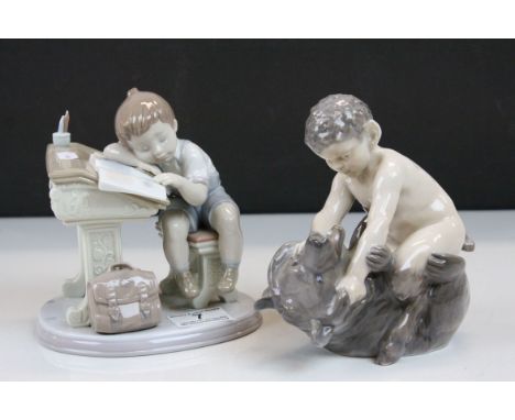 Royal Copenhagen ceramic model of a Faun wrestling a Bear, numbered 648 plus a Lladro ceramic model of a Boy sleeping at a Sc