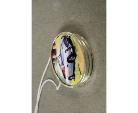 Silver and enamel lidded pill box with Aston Martin image