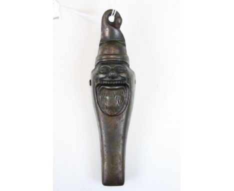 Vintage metal nutcracker in the form of bearded man with registration number