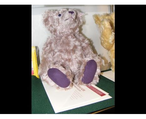 A collectable modern Steiff teddy bear with certificate - 34cms tall