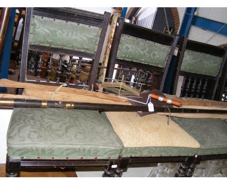 A selection of vintage fishing rods etc.