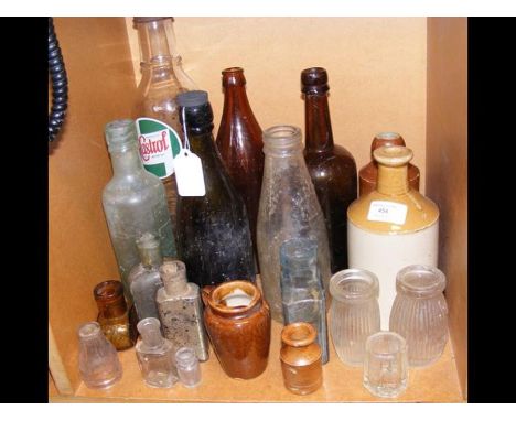 Various vintage bottles, including Castrol 