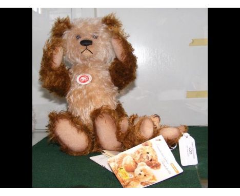 A collectable Steiff teddy bear - 31cms together with matching baby teddy 15cms