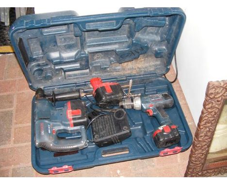 A Bosch hammer drill, cordless drill, together with charger - in case