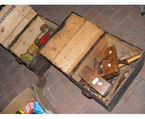 A selection of wooden boxes of woodworking hand tools including vintage planes
