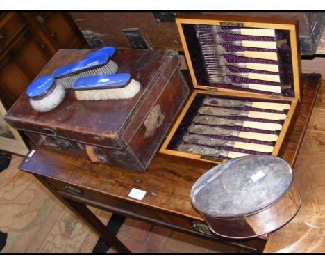 A vintage case with divisions, four items of guilloche enamel ware, plated tea caddy, together with a set of fish knives and 