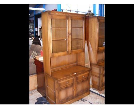 The matching Ercol side cabinet with glazed doors to top - width 100cm 