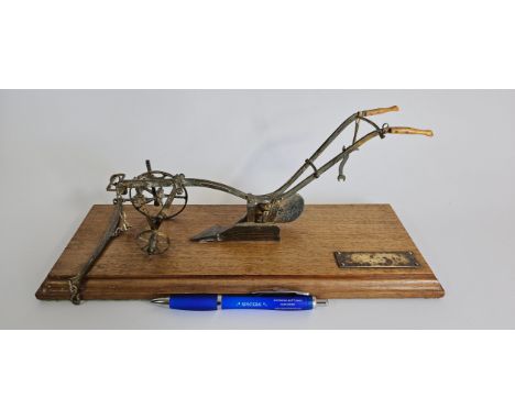 A model single mullboard horse drawn plough limited edition model, with wooden handles, spanner and hammer, mounted on a maho