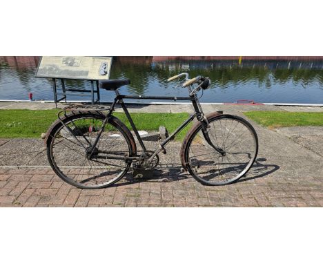 A Raleigh gentleman's bicycle, with rod brakes and 3 speed gears, for restoration.
