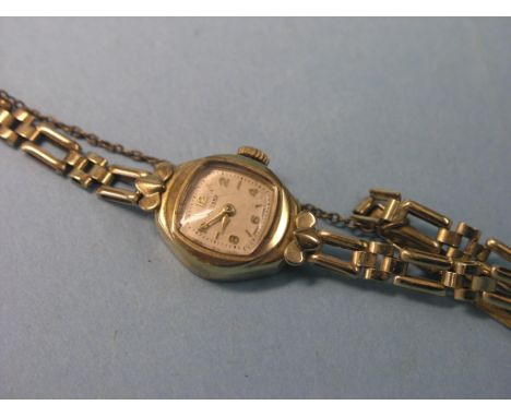 A lady's 9ct. gold Rotary wristwatch, on flexible 9ct. gold bracelet strap, 11.8 grams gross total