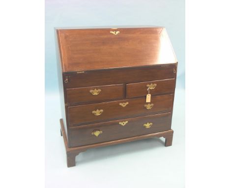 A George II mahogany bureau, fall-front enclosing stepped interior with well, two short and two long oak-lined drawers beneat