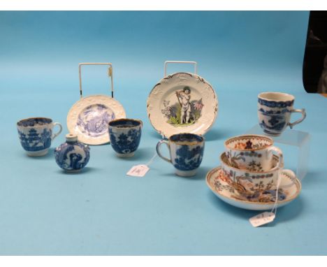 Two late 18th century English pearlware coffee cups, two other porcelain coffee cups, all painted in underglaze blue, two 19t