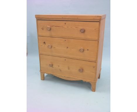 An early Victorian stripped pine chest, three long drawers, each with turned wood knob handles, bracket feet, 3ft. 1in