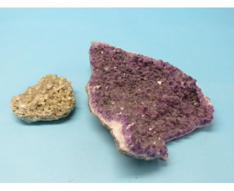 A large section of uncut amethyst, 17in. and a section of uncut quartz, 7.5in