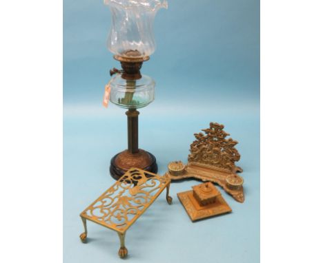 A Victorian oil lamp, embossed brass with glass reservoir and shade, 26in. together with a Victorian cast brass desk-stand, s