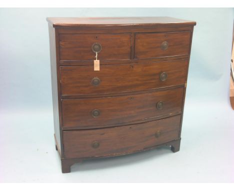 An early Victorian mahogany chest, bow-fronted with two short and three long drawers, pressed brass drop handles, bracket fee