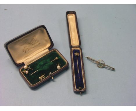 A Victorian 9ct. gold and aquamarine bar brooch, a leather-cased seed-pearl bar brooch, a cased tie-pin and two pairs of ear-