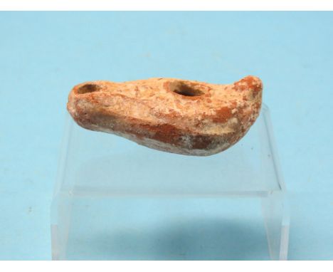 A Levant terracotta oil lamp, with cast detail, circa 100-200AD, 3.5in. long