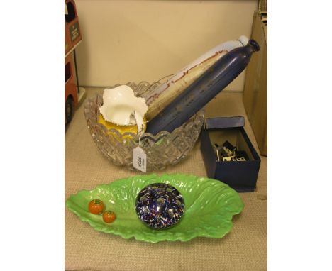 A 19th century coloured glass paperweight, with inset air tears, 3in., together with two novelty coloured glass rolling pins,