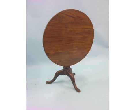 A George III mahogany tripod table, circular tilt-top on baluster stem, top 2ft. 10in