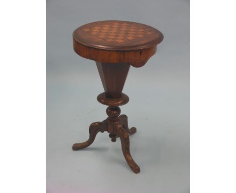 A Victorian inlaid walnut work table, hinged circular top enclosing fittings and recess, on carved tripod base, 1ft. 6in. dia