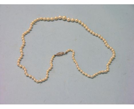 A cultured pearl necklace, single-strand with graduated pearls, 9ct. white gold clasp with diamond chip
