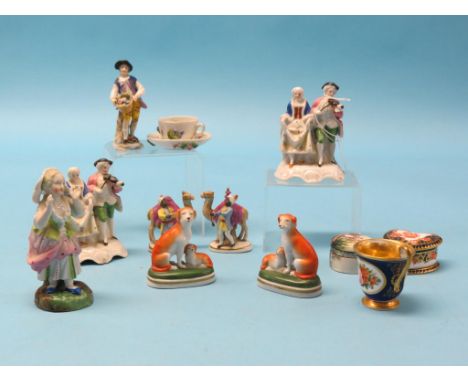 Two Victorian Staffordshire bone china cottage pastille burners and twelve other 19th century ceramic ornaments, some damage