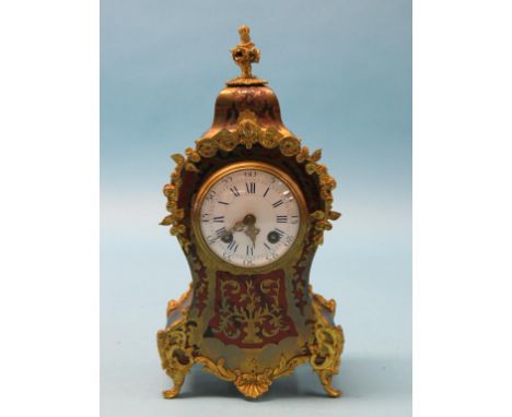 A late 19th century boulle mantel clock, rococo-shape with ormolu mounts, convex enamelled dial, Japy movement striking on a 