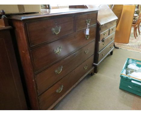 A late George III mahogany chest, cross-banded top above two short and three long oak-lined drawers, on bracket feet, 3ft. 8i