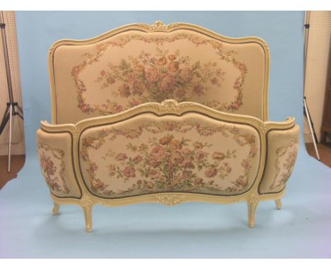 A Louis XV-style cream-painted bedstead, upholstered in floral machine tapestry, 4ft. 6in. - as viewed