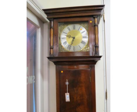 A Georgian-style mahogany longcase clock, with square brass dial and 30-hour movement, trunk door flame-veneered, with pendul