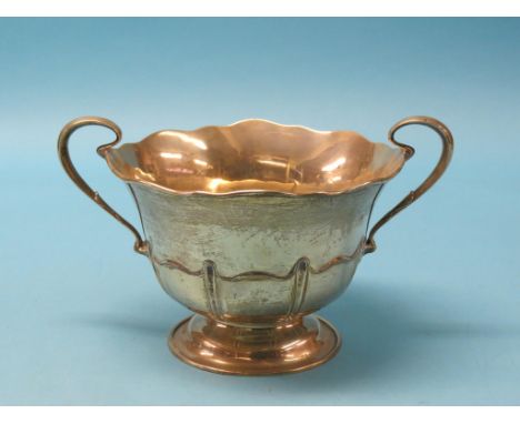 A large silver two-handled bowl, circular-shape with embossed detail, Sheffield 1910, approx. 27oz together with a silver pla