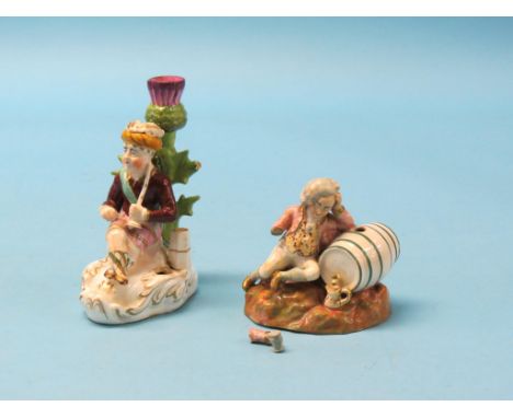 An early 19th century old English porcelain candlestick figure, Turk resting beside thistle, 6in. together with an early Vict