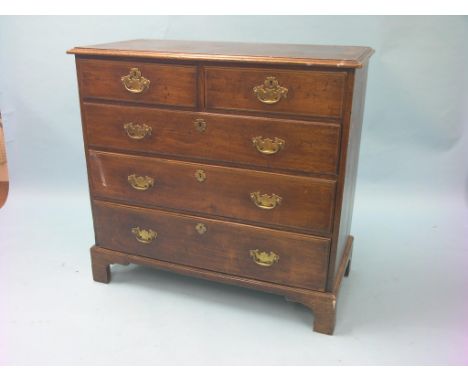 A George III provincial oak chest, two short and three long drawers, pine drawer-linings, on bracket feet, 3ft. 5in
