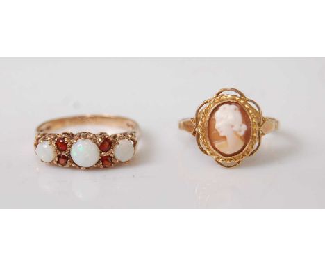 Two 9ct yellow gold rings, comprising an oval shell cameo depicting a figure of a lady within a rope and openwork surround, c