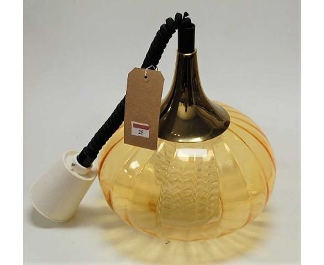 A 1960s amber glass onion shaped hanging pendant ceiling light, having a metal attachment, plastic ceiling rose, with coiled 