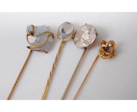 Four various stick pins, to include moonstone and old cut diamond horse head, and a Napoleon exampleCondition report: Some st