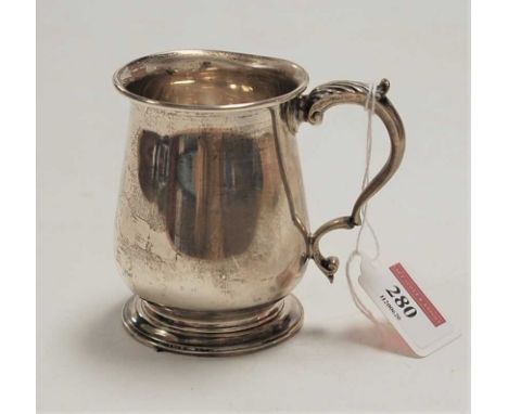 A George V silver christening mug, of bell shape, having a flying C-scroll handle, engraved with initials and dated September