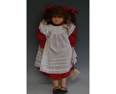 A modern Steiff bisque collectors doll Monika, limited edition No.158 of 300, having fixed brown eyes, painted freckles, and 