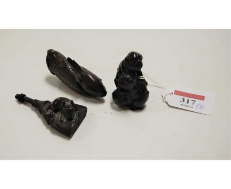 A collection of three carved wooden netsuke, comprising entwined koi carp, rat on a broomstick, and dog with young, the large