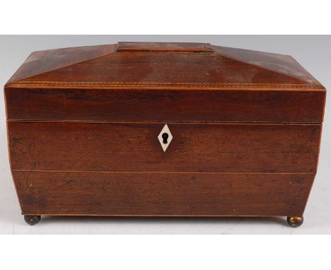 A late George III partridge wood and chequer strung tea caddy, of shaped rectangular form, the hinged lid revealing twin comp