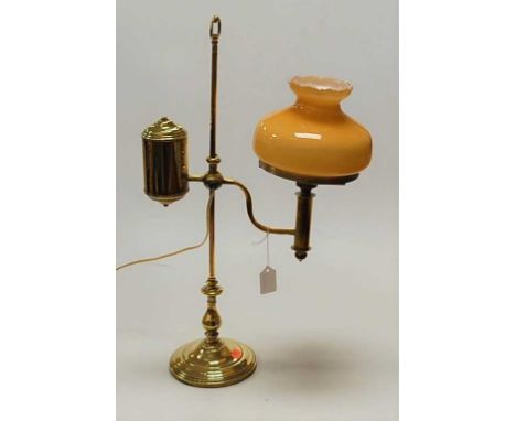 A Victorian brass desk lamp, having rise-and-fall action and opaque glass shade (later converted for electricity), h.53cm